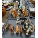 Two trays of dog figurines to include: Sylvac and other Corgis, Bulldog, Trentham Art ware puppies