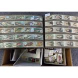 Cigarette Cards and various trade cards in 3 boxes, loose and in bundles & a large album of Wills