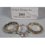 9ct gold eternity style ring (1.8g approx), together with a silver solitaire design dress ring and