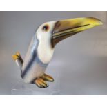 A novelty ceramic study of a seated toucan. (B.P. 21% + VAT)