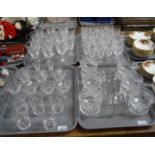 Four trays of glassware to include: various drinking vessels, liqueur glasses, dessert bowls, set of