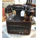 Vintage bakelite and wooden dictograph telephone system with rows of exchange switches. (B.P.