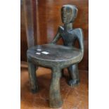 African tribal hardwood child's chair with figural back rest. (B.P. 21% + VAT)