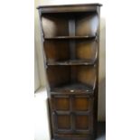 Ercol type stained elm corner cupboard with two shelves. (B.P. 21% + VAT)