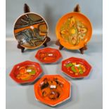 Collection of Poole pottery mainly orange/red ground design items to include: octagonal dishes and