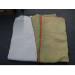 Two vintage Welsh quilts; one cream and the other pale green with orange reverse, both with sewn