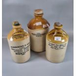 Collection of stoneware flagons to include: 'Horrocks & Sons, Merthyr', 'South Wales Herbal Brewery,