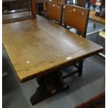 Early 20th century oak cleated three plank top refractory type table together with two leather