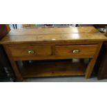 Early 20th century rustic pine dresser base, the moulded top above two drawers with pot base and
