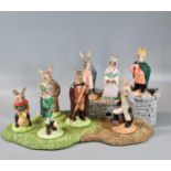 Royal Doulton 'Bunnykins' The Robin Hood Collection Base with eight figurines. (B.P. 21% + VAT)
