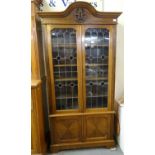 Early 20th century mahogany two door glazed stained glass and leaded bookcase on bracket feet. (B.P.