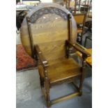 Early 20th century oak Monk's Seat with carved circular back an moulded seat. (B.P. 21% + VAT)
