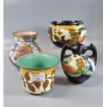 Four Dutch Gouda pottery florally hand painted items to include: vases and baluster planters of