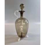 Art Deco design smoked glass baluster decanter and stopper with nude figurine standing on a