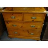 Early 20th century pine straight front chest of two short and two long drawers on platform base