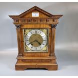 Early 20th century walnut architectural two train mantle clock, with silver chapter ring and Roman