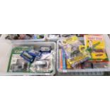 Two boxes of assorted diecast model vehicles to include: reproduction Dinky Toys, Dinky Cars with