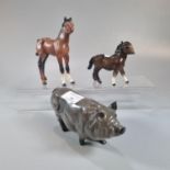 Beswick and Royal Doulton ceramic Foals together with a Royal Doulton Pig. (B.P. 21% + VAT)
