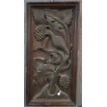 Deeply carved oak panel depicting bird amongst foliage. 42x18cm approx. (B.P. 21% + VAT)