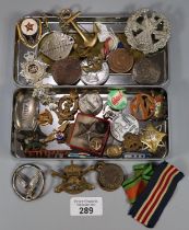 Tin of assorted and various Military badges and insignia, dog tag, medallions etc. (B.P. 21% + VAT)