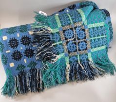 Blue ground vintage Welsh woollen tapestry blanket with fringed edge and traditional Caernarfon