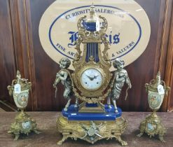 French style Empire design two train ornate brass clock garniture set with satyr figures. (3) (B.