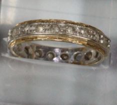 18ct gold eternity ring. 3.1g approx. Missing one stone (not diamonds). (B.P. 21% + VAT)