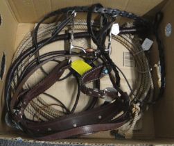 Box of horse riding equipment to include: a Native American style bridle and reins with 'Showman'