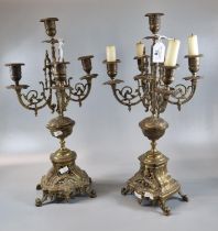 Pair of ornate brass rococo style four branch table candelabrum. (2) (B.P. 21% + VAT)