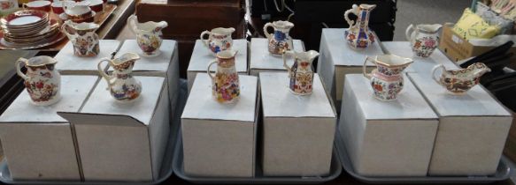 Three trays containing eleven boxed miniature Mason's Ironstone for Compton & Woodhouse dresser jugs