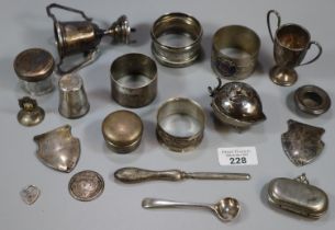 Bag of silver and silver plate to include: miniature two handled trophy cups, napkin rings, pill