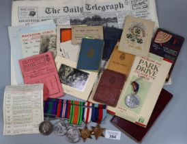Collection of assorted ephemera and medals, to include: 1952 Daily Telegraph newspaper, Album of