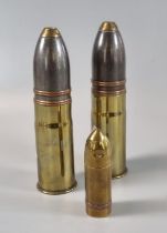 Two deactivated military shells marked 37-85 over 376 together with a brass military shell shaped