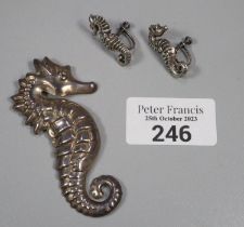 Silver seahorse brooch an a pair of matching earrings marked Sterling. (B.P. 21% + VAT)