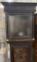 Carved oak long case clock with brass face and later 19th century movement, the face marked 'John