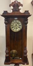 Early 20th century walnut two train Vienna type wall clock with pendulum, keys and weights. (B.P.