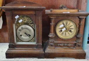 Two early 20th century two train architectural design mantle clocks, one with silvered face, the