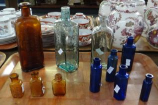 Tray of glass medicine bottles to include; Fennings fever curer, cough cure, Liqufruta,