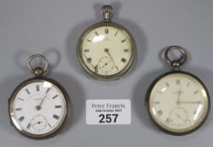 Two silver keyless lever open faced pocket watches and another Omega key wind white metal open faced