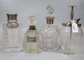 Collection of lead crystal decanters and stoppers, some with silver collars, one with a plated