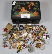 Russian lacquered box comprising badges and other items to include: RMS Queen Elizabeth,
