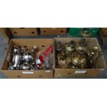 Two boxes of metalware to include: brass candlesticks, lamp base, oil lamp bases, a football trophy,