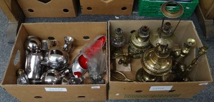 Two boxes of metalware to include: brass candlesticks, lamp base, oil lamp bases, a football trophy,