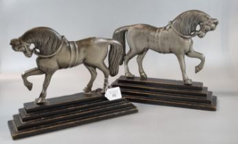 Pair of white metal horse shaped door stops or andirons (handed). (2) (B.P. 21% + VAT)