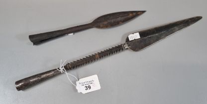 Two steel spearheads one with barbed shaft. The longest 38cm approx. (B.P. 21% + VAT)