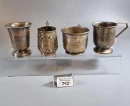 Three silver christening mugs, one marked Sterling, some with inscriptions, together with another