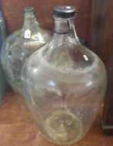 Two similar glass demi johns or dispensing jars. (2) (B.P. 21% + VAT)