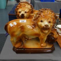 Pair of Staffordshire pottery lions with glass eyes. (B.P. 21% + VAT)