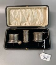 Early 20th century three piece cruet set with blue glass liners in original box. 2.2 troy oz approx.