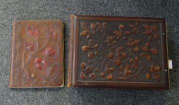 Two leather embossed design late 19th/early 20th Century blotting pads; one Art Nouveau style with